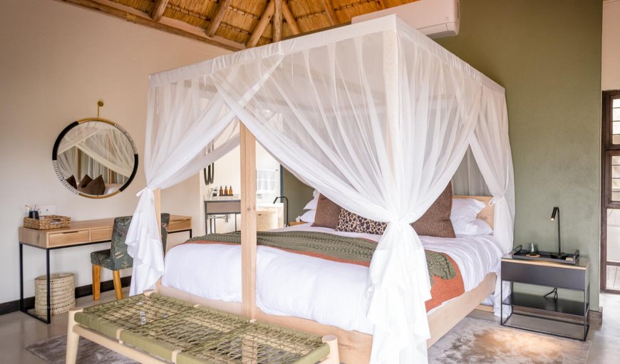 Tulela Safari Lodge: Each suite is furnished with a queen-size bed fitted with mosquito nets