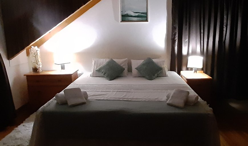 King size bed at night in C-Place, Jeffreys Bay, Eastern Cape, South Africa