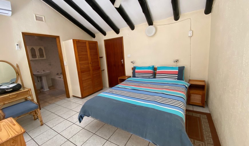 Uvongo Cabanas 16B: Main loft bedroom with a queen size bed