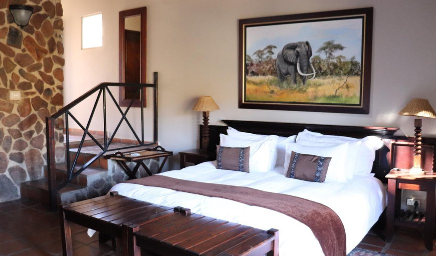 Chalet Room (max 2): Elephant Chalet Room (max 2) - Bedroom with a king size bed (or twin beds)