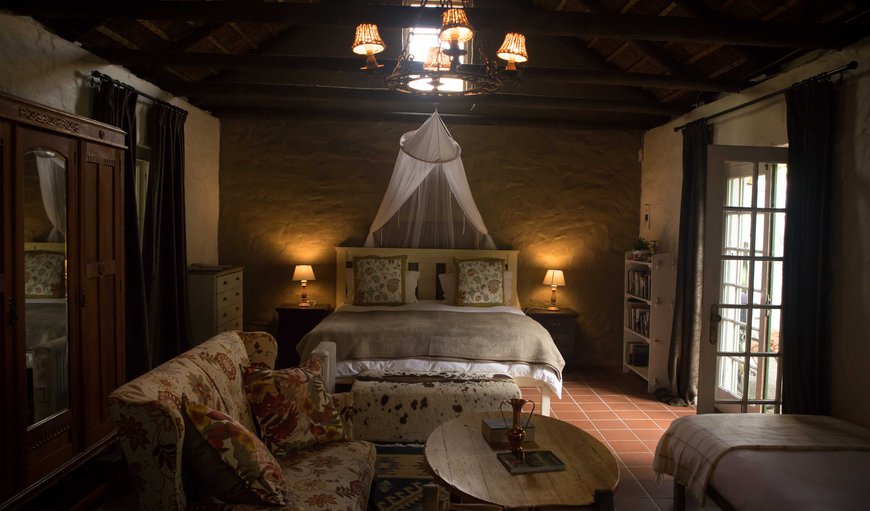Self catering cottage: There is a large king size bed with mosquito net