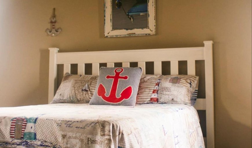Sea View Cottage: Bedroom with a queen size bed and twin beds