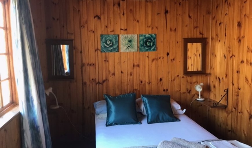 Hoopoe Log Cabin: Bedroom with a double bed