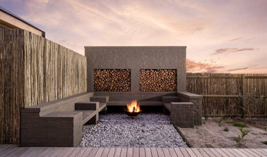 There is an expansive North facing enclosed courtyard with built-in seating, a firepit and a covered Pergola with outside dining area and an external braai There is an expansive North facing enclosed courtyard with built-in seating, a firepit and a covered Pergola with outside dining area and an external braai
