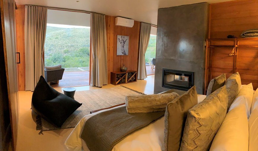 Valley Pod: The bedroom contains a king-size bed, and has an en-suite bathroom with a bath and a shower