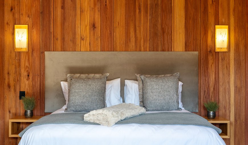 The bedroom area is furnished with a king-size bed and features an en-suite bathroom with a bath and a shower The bedroom area is furnished with a king-size bed and features an en-suite bathroom with a bath and a shower