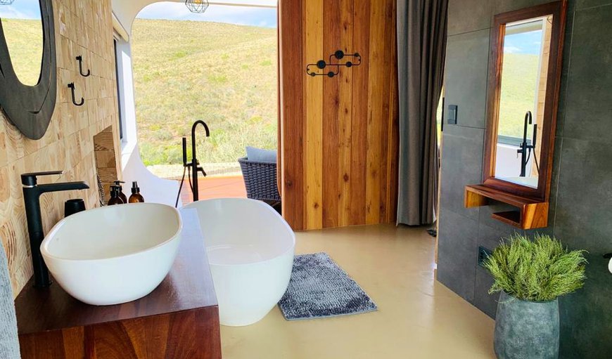 The bedroom and bathroom lead onto a patio, which boasts a hot tub overlooking the picturesque valley; the ideal spot to relax and enjoy the beautiful views The bedroom and bathroom lead onto a patio, which boasts a hot tub overlooking the picturesque valley; the ideal spot to relax and enjoy the beautiful views