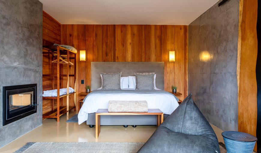The bedroom area is furnished with a king-size bed and features an en-suite bathroom with a bath and a shower The bedroom area is furnished with a king-size bed and features an en-suite bathroom with a bath and a shower