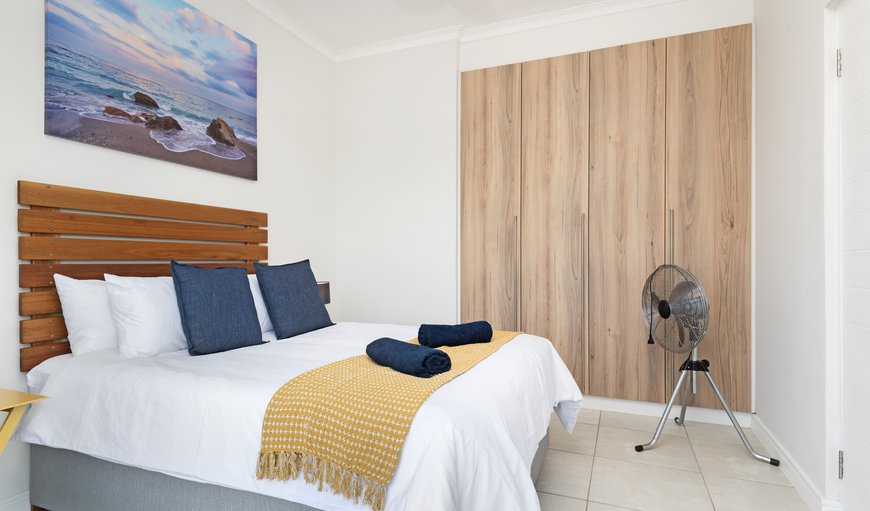 Ballito Hills 136: The sea-facing bedroom has a double bed, is stylishly decorated with bright accents, and boasts glass sliding doors for balcony access and a ton of natural light during the day and amazing starlit views at night