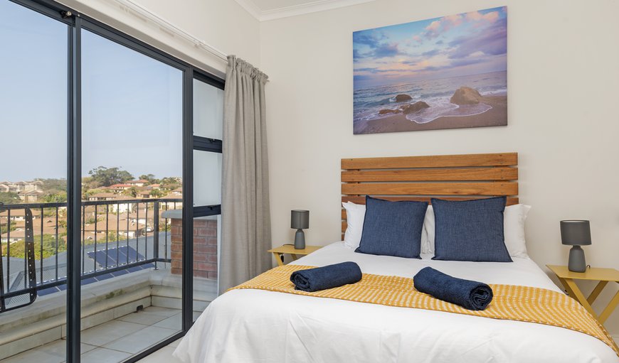 The sea-facing bedroom has a double bed, is stylishly decorated with bright accents, and boasts glass sliding doors for balcony access and a ton of natural light during the day and amazing starlit views at night The sea-facing bedroom has a double bed, is stylishly decorated with bright accents, and boasts glass sliding doors for balcony access and a ton of natural light during the day and amazing starlit views at night