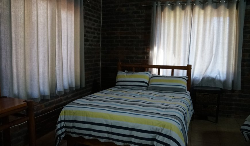 Kudu: Kudu - Bedroom with a double bed and 2 single beds