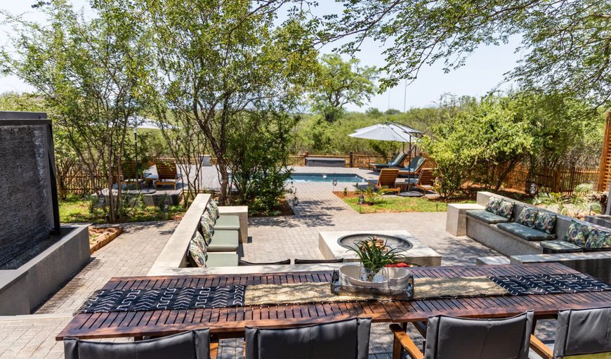 Patio with seating overlooking the swimming pool