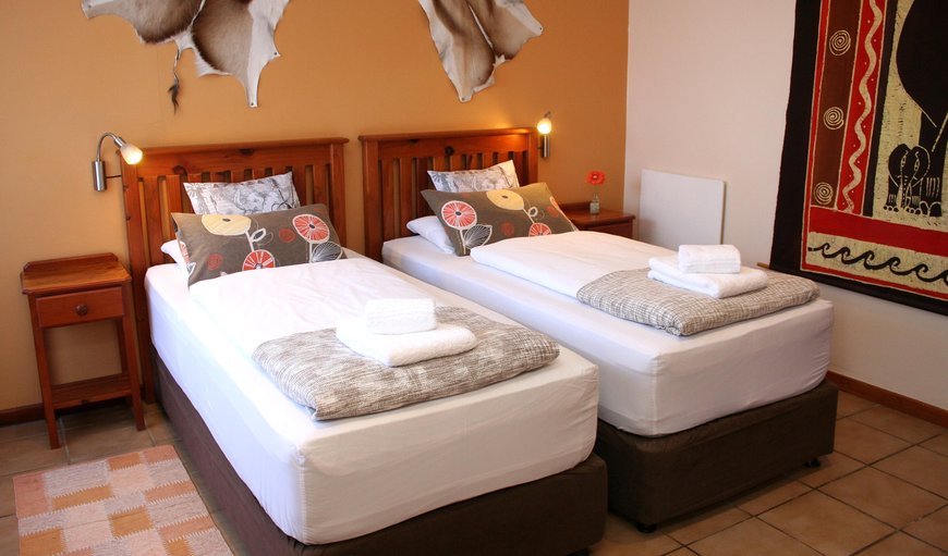 Africa bedroom with two single beds. Both rooms offer TV, tea & coffee trays, heater, hairdryers, safes and exclusive showers / WC en-suite. Africa bedroom with two single beds. Both rooms offer TV, tea & coffee trays, heater, hairdryers, safes and exclusive showers / WC en-suite.