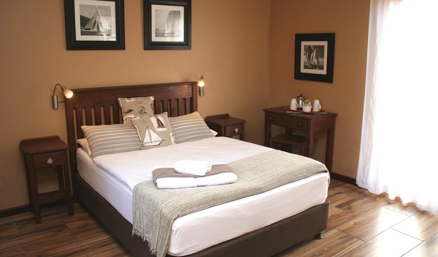 Captains Cabin bedroom with en-suite bathrooms, DSTV, hairdryer, tea and coffee making facilities, soap and shower gel, heating, fans and their own entrance laid to the tranquil courtyard, equipped with sundeck chairs and umbrellas. Captains Cabin bedroom with en-suite bathrooms, DSTV, hairdryer, tea and coffee making facilities, soap and shower gel, heating, fans and their own entrance laid to the tranquil courtyard, equipped with sundeck chairs and umbrellas.