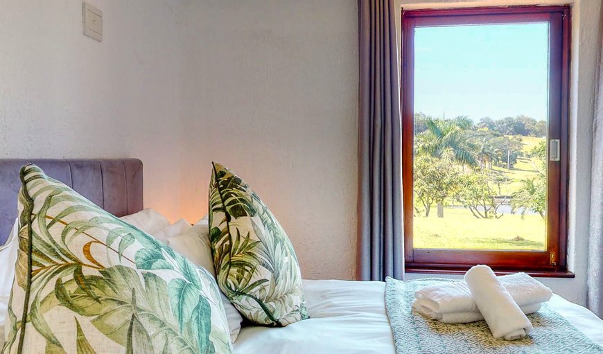 Bedroom with a king size bed in San Lameer, Southbroom, KwaZulu-Natal, South Africa