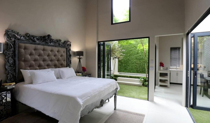 Another World: Bedroom with extra length king-size bed