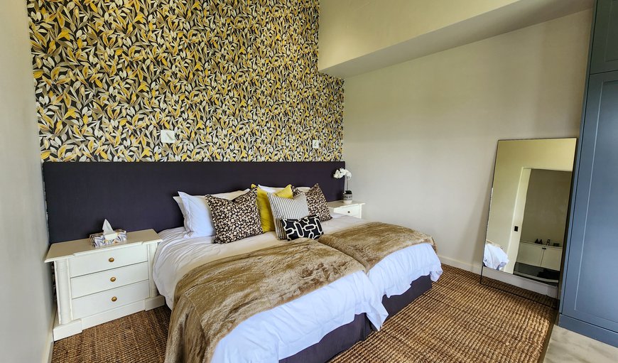 The bedroom sleeps 2 guests and the bed can be configured as a super king or split into ¾ beds. A full-length mirror is available. The bedroom sleeps 2 guests and the bed can be configured as a super king or split into ¾ beds. A full-length mirror is available.