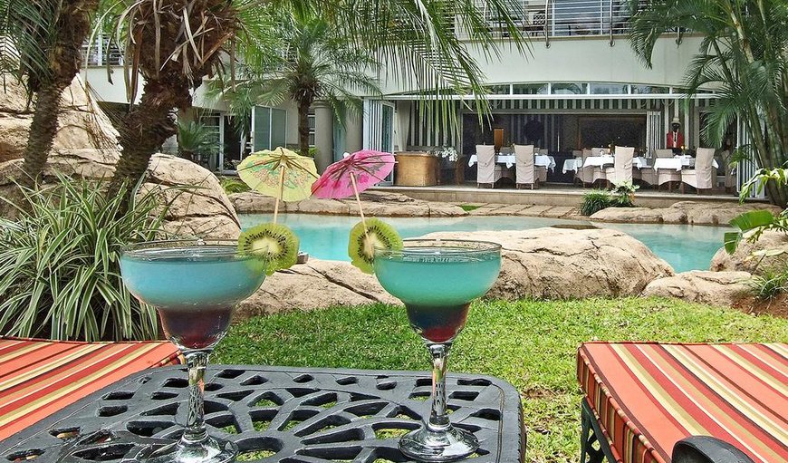 Enjoy a refreshing cocktail by the pool as  you soak up some sun
