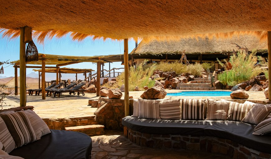 Terrace and pool area with comfortable outdoor lounge in Sossusvlei , Hardap, Namibia