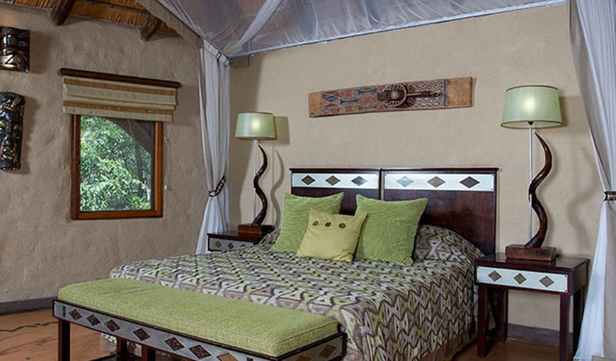 Premier Suites: Bedroom with a double bed.
