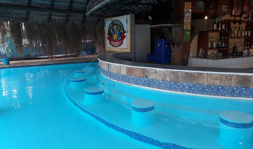 Sunset Lodge features a beautiful swimming pool that surrounds the bar where guests can enjoy a cocktail. Sunset Lodge features a beautiful swimming pool that surrounds the bar where guests can enjoy a cocktail.