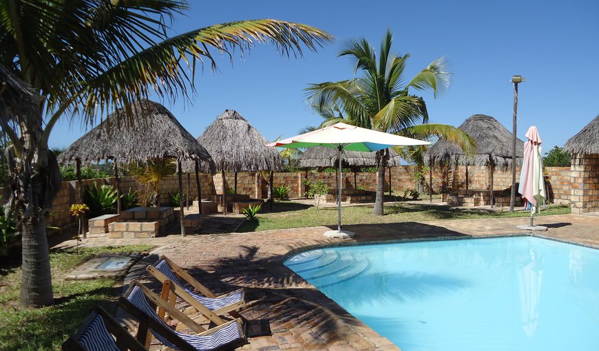 Sunset Lodge features a beautiful swimming pool that surrounds the bar where guests can enjoy a cocktail. Sunset Lodge features a beautiful swimming pool that surrounds the bar where guests can enjoy a cocktail.