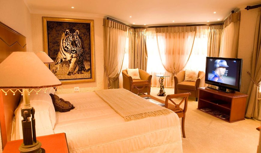 King Suite: King Suite with jacuzzi,shower,bath,DSTV and WIFI.