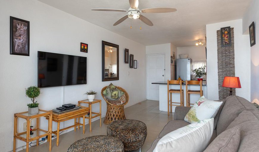 The lounge area is tastefully furnished with comfortable couches and a TV with DSTV and a DVD player. The lounge area is tastefully furnished with comfortable couches and a TV with DSTV and a DVD player.