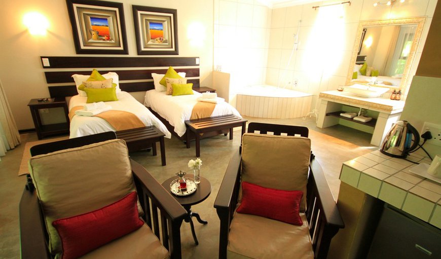 The Joy Room - This luxurious room offers a king size bed or two single beds with an open plan bathroom containing a corner bath. The Joy Room - This luxurious room offers a king size bed or two single beds with an open plan bathroom containing a corner bath.