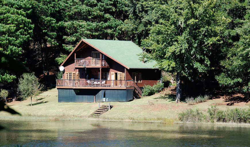 A beautiful 4 Bedroom log style home built on the edge of the 4-hectare Brown and Rainbow trout dam.