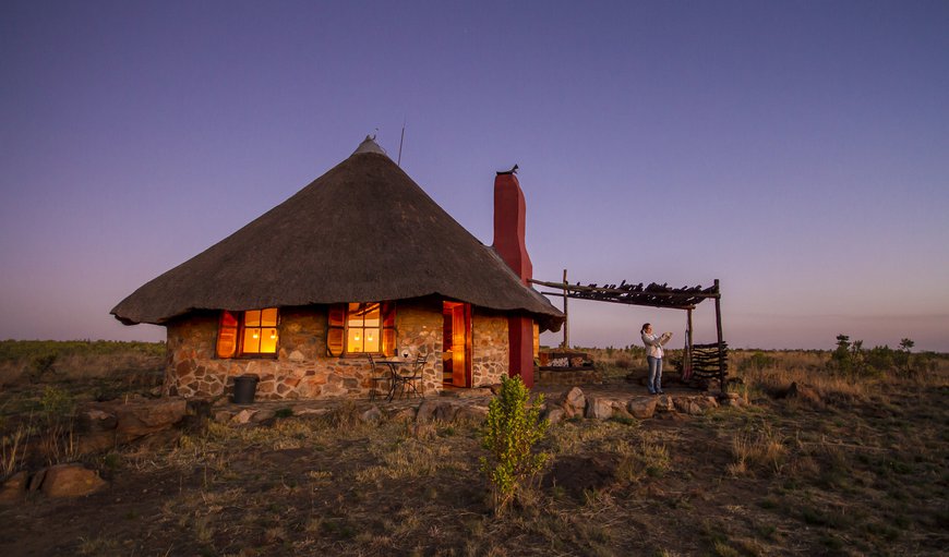 Agama cottage in the evening with candles ablaze in Magaliesburg, Gauteng, South Africa