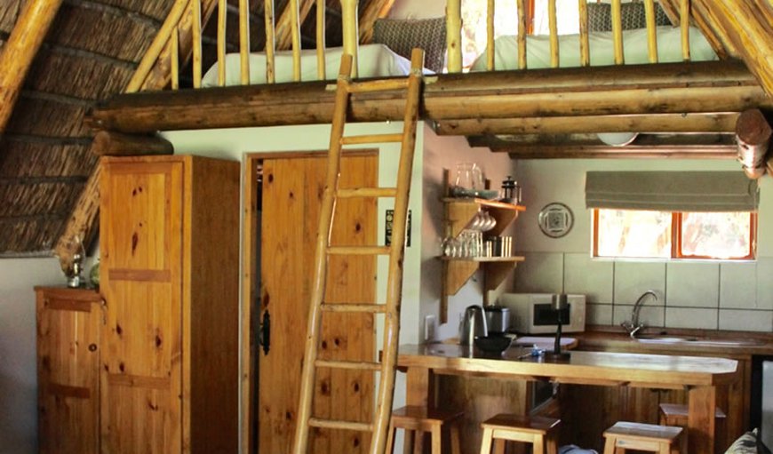 Standard Self Catering Chalet - The kitchen is equipped for self catering and right below the loft area. Standard Self Catering Chalet - The kitchen is equipped for self catering and right below the loft area.