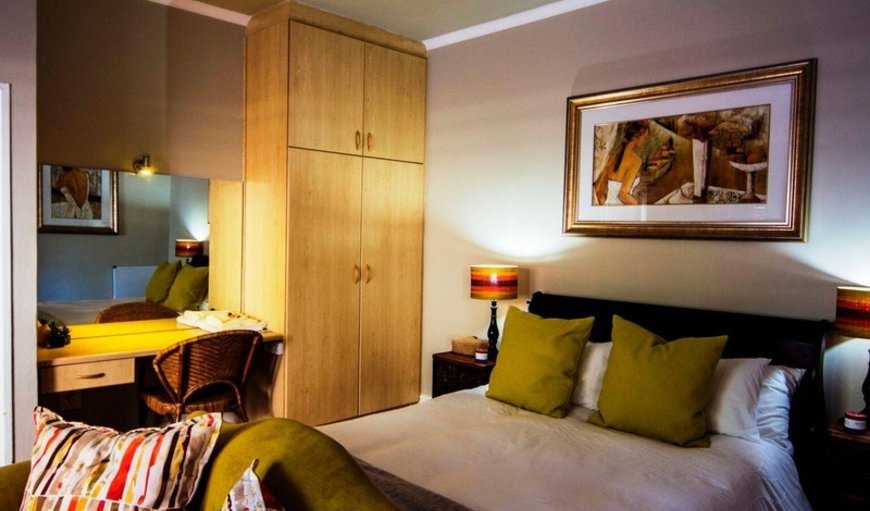 Standard Suite: Standard Suite - Bedroom with a queen size bed
