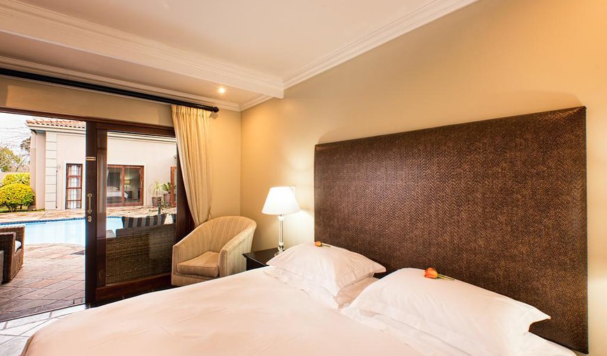 Room 3 Outside Pool Area: Deluxe bedroom suite with views of the pool and comfortable sleeping quarters