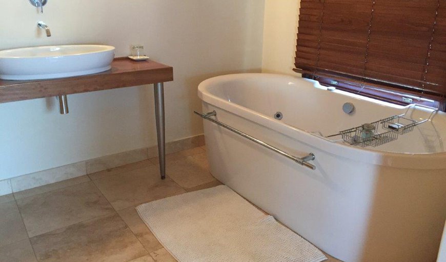 Executive Rooms - One en-suite bathroom has a Jacuzzi bath with an open shower and the other has a bath and shower. Executive Rooms - One en-suite bathroom has a Jacuzzi bath with an open shower and the other has a bath and shower.