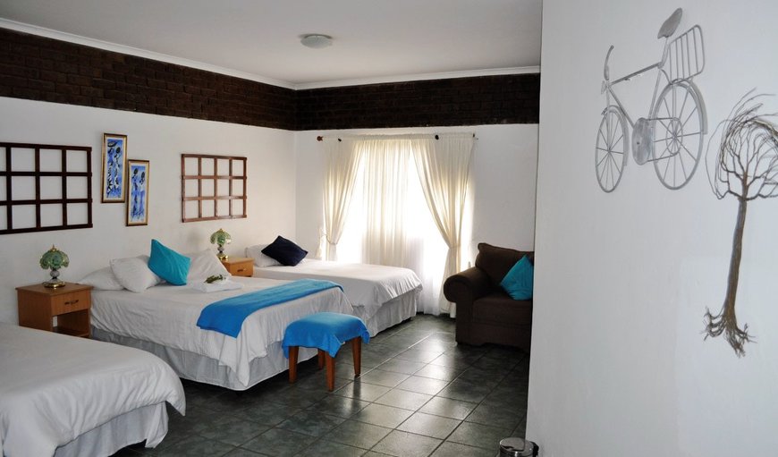 4-Sleeper Rooms (1 Double, 2 Singles): 4-Sleeper Rooms (1 Double, 2 Singles) - Bedroom with a double bed and 2 single beds