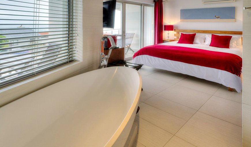 Bay View Room- The bathroom features a modern freestanding deep soaking tub in which you can relax and a separate shower, both with amazing sea views. Bay View Room- The bathroom features a modern freestanding deep soaking tub in which you can relax and a separate shower, both with amazing sea views.